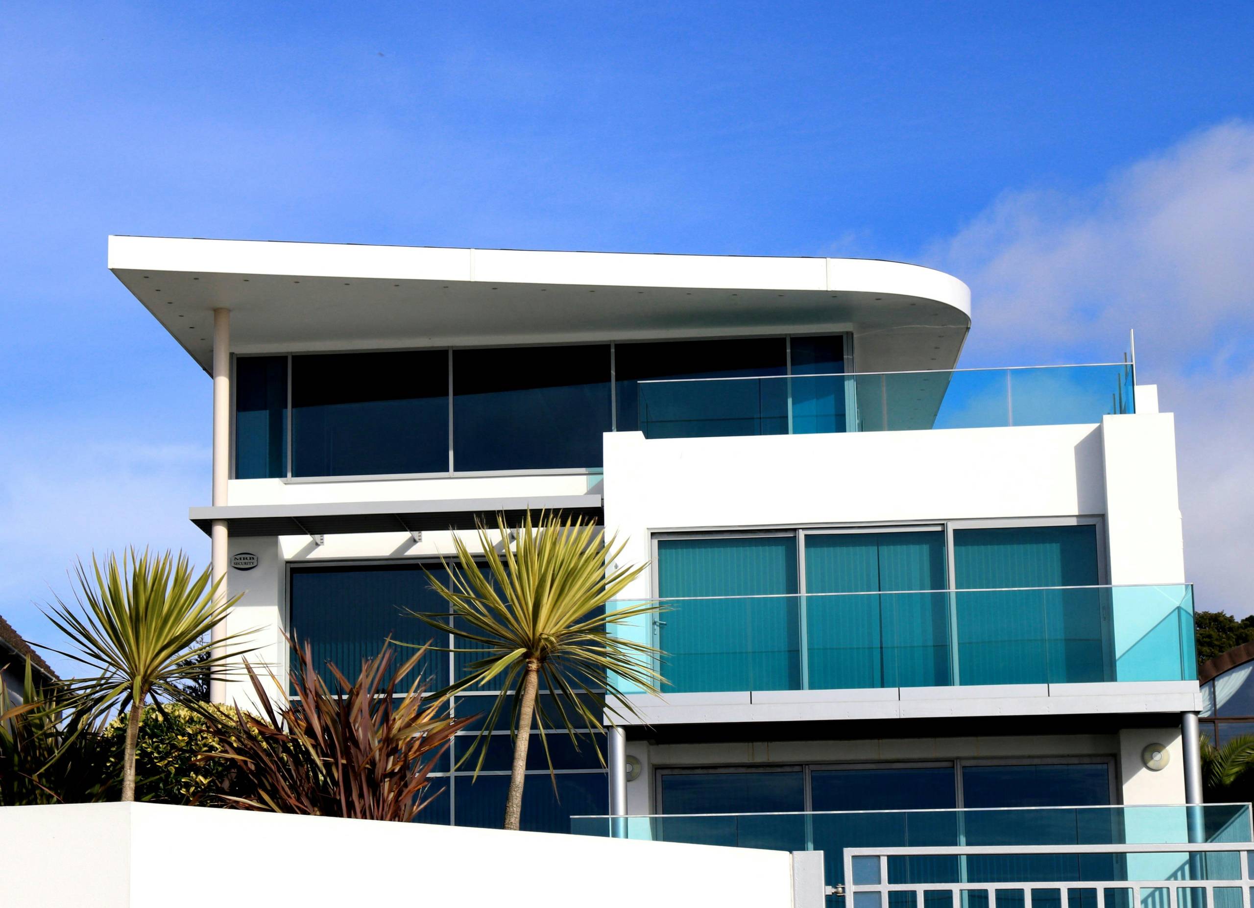 Modern white home with large glass windows