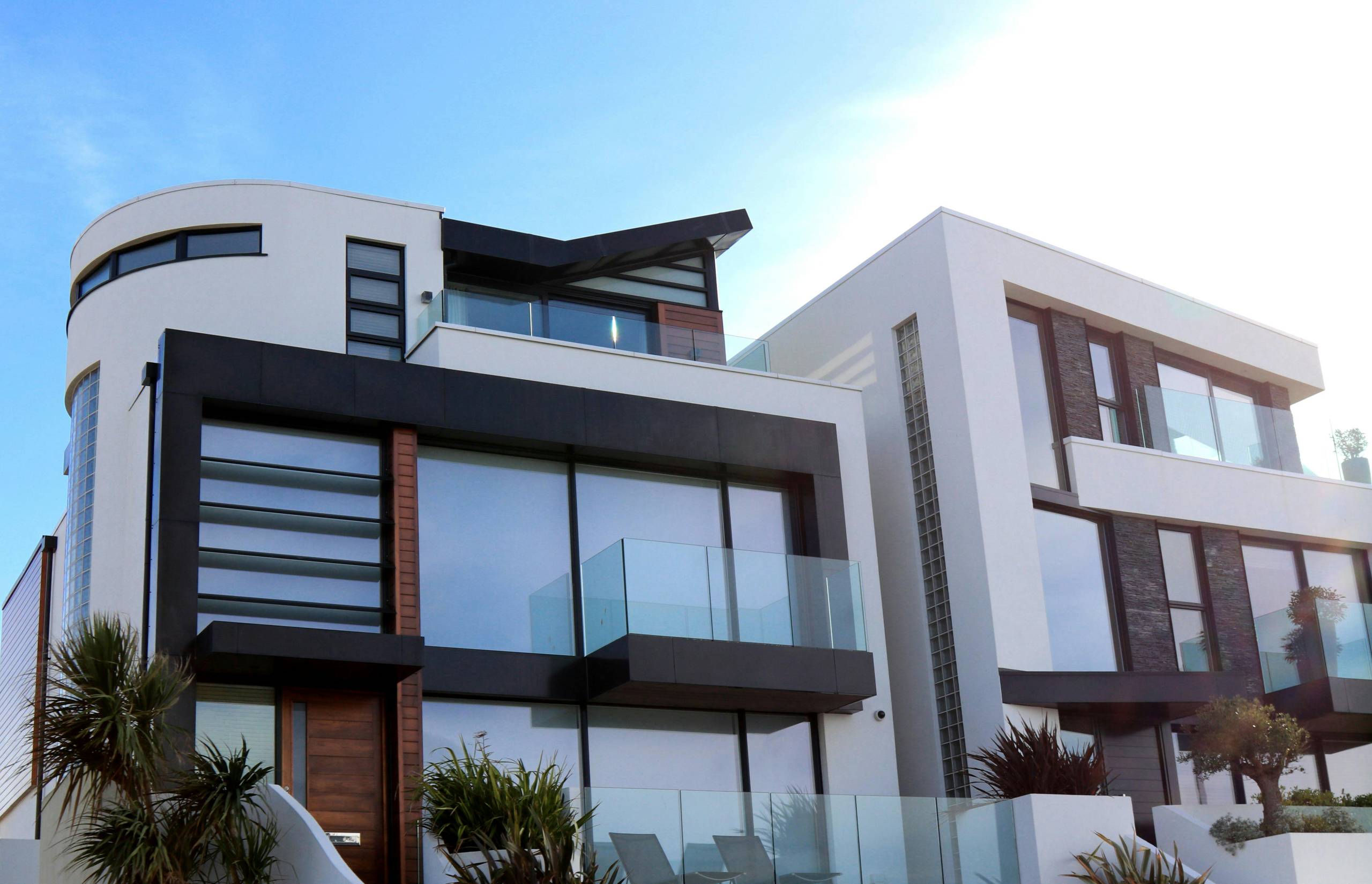 Modern home exterior with white and dark cladding