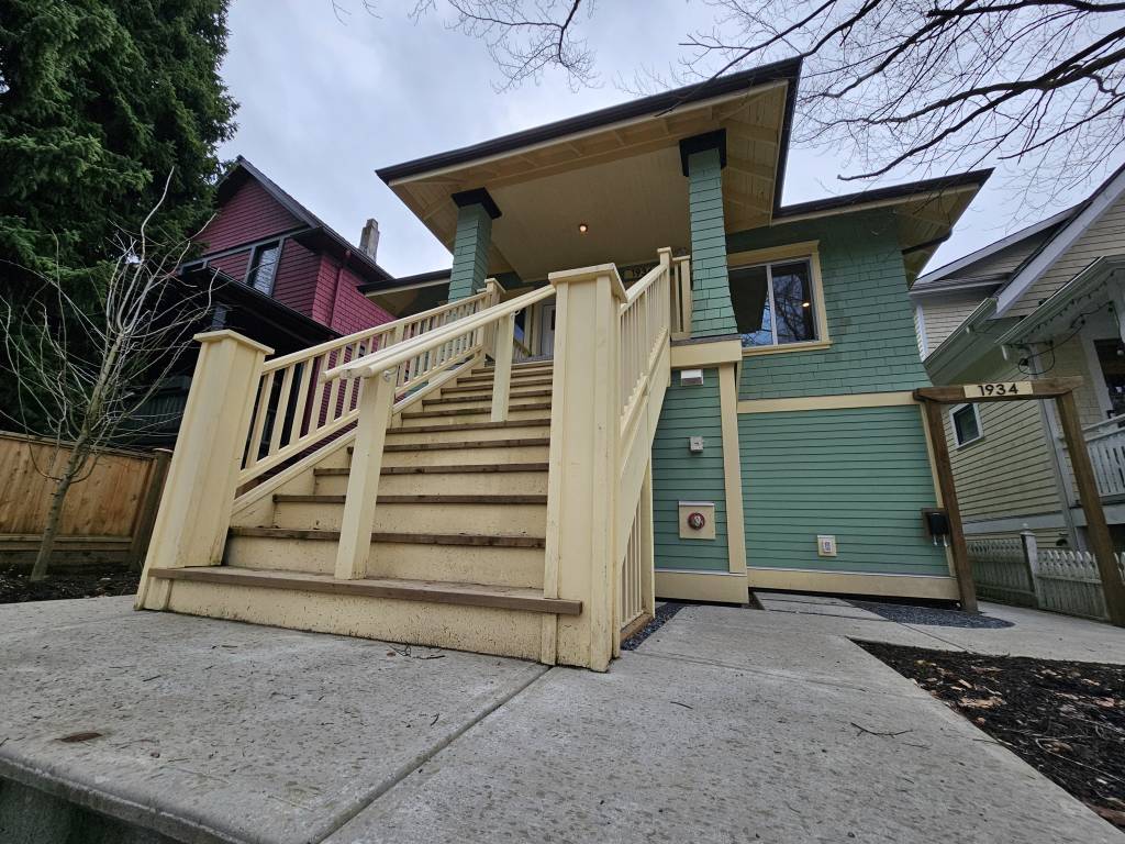 Green heritage home with James Hardie siding and new front stairs