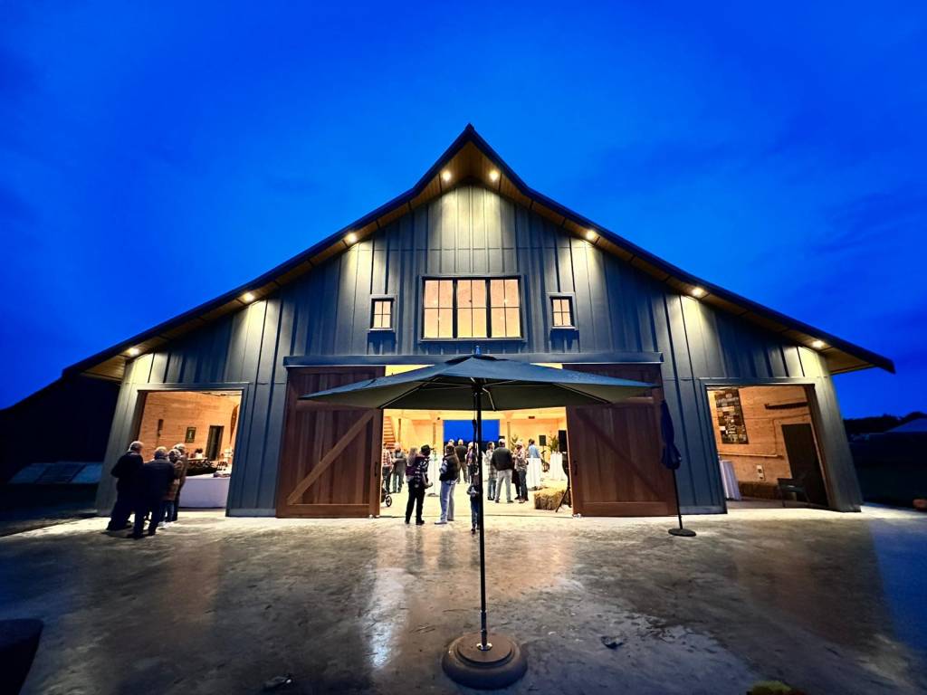 Westham Island barn with board-and-batten siding lit at night