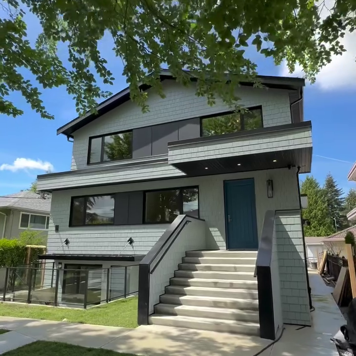 Front exterior of a completed Net Zero home with new siding